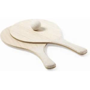 A set of two wooden paddle bats with smooth handles, featuring a lightweight ball resting on one.