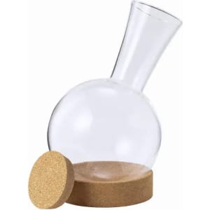 A drink bottle with a round glass body and a tapered neck, featuring a cork base and a cork lid.