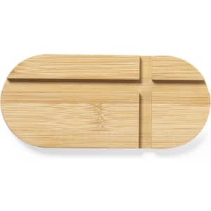 A bamboo serving tray in a sleek oval shape with divided compartments and a natural finish.