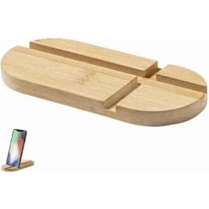 A wooden phone stand with an oval shape and two grooves for holding devices, showcasing a natural finish.