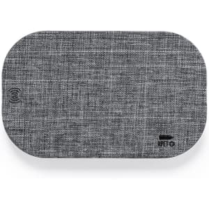 A grey fabric phone stand with an oval shape, featuring a small logo at the bottom corner.