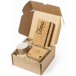 A gift box containing a wireless charger and a speaker, both in natural colours, with a logo on the charger.