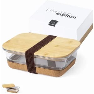 A storage container featuring a glass base, a bamboo lid, and a cork bottom, secured with a brown strap.