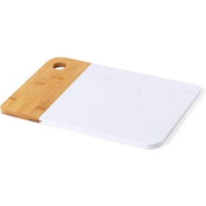 A chopping board featuring a bamboo handle and a white marble surface, with a hole for hanging.