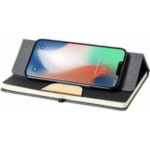 A phone stand with a textured grey exterior and a wooden base, holding a smartphone upright.