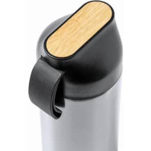 A drink bottle in silver with a black top and a bamboo accent. It features a black strap for easy carrying.