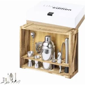 A wooden crate containing a set of stainless steel barware tools and accessories. The items are neatly arranged within.