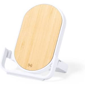 A wireless charger with a bamboo top and white base, featuring a logo.