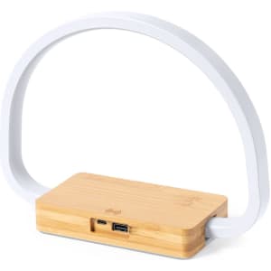 A desk lamp with a bamboo base and a white arch-shaped light. Features USB ports on the base.