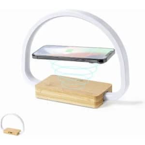 A phone holder with a white arch and a bamboo base, featuring a space for a phone to rest.