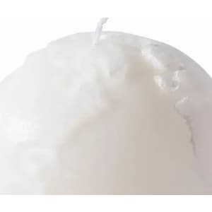 A white candle with a textured surface and a wick at the top. It has a simple, elegant design.