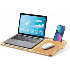 A wooden laptop desk featuring a silver laptop, white mouse, and space for a smartphone, with a sleek design.