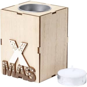 A wooden candle holder with a star-decorated "XMAS" label and a tealight candle beside it.
