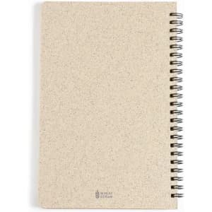 A notebook with a natural beige cover, featuring a spiral binding and subtle texture. It has a logo at the bottom.