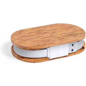 A USB drive with a wooden exterior and a white body, featuring an oval design.