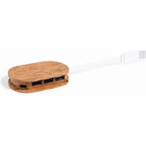 A USB hub with a wooden finish, featuring three USB ports and a connecting cable.