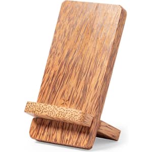 A wooden phone stand with a textured, natural finish, featuring a sturdy base and angled support.