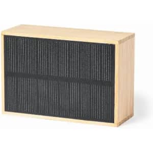 A rectangular wooden box with a textured black front panel and natural wood sides. Features a simple, sleek design.