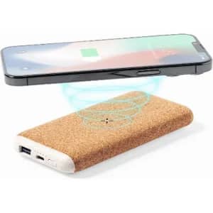 A wireless charger with a cork exterior and a smartphone hovering above it, indicating charging capability.