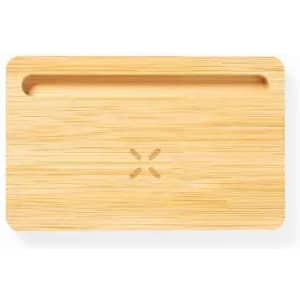 A bamboo cutting board with a groove along one edge and a subtle logo in the centre. Natural wood colour.