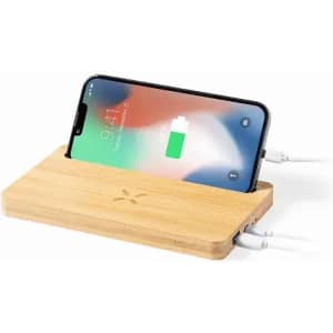 A wireless charger made from bamboo, featuring a sleek design with a smartphone placed on top for charging.