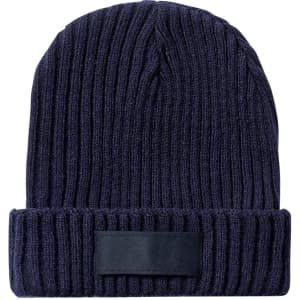 A navy blue knitted beanie with a ribbed texture and a plain black label on the front.
