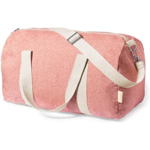 A duffel bag in a soft pink hue with cream straps and a zip closure. It features a shoulder strap and branding.