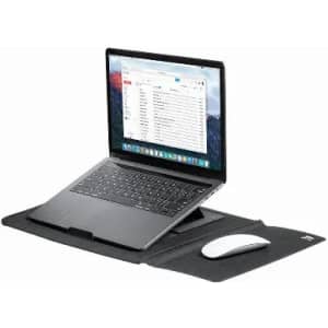 A laptop in silver rests on a black desk mat, accompanied by a white computer mouse. The mat features a slot for the laptop.