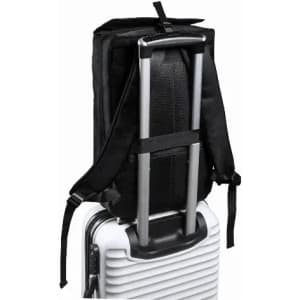A black backpack attached to a suitcase handle, featuring adjustable straps for secure transport.