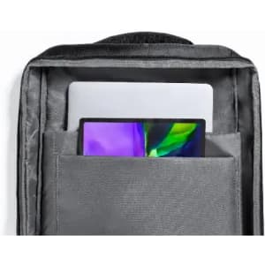 A grey backpack interior featuring a laptop and a tablet in separate pockets. It has a simple, utilitarian design.