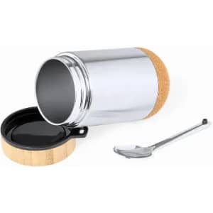A drink bottle with a silver metal body, cork lid, and a metal spoon beside it. The bottle has a logo.