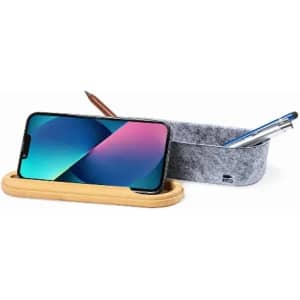 A desk organiser with a bamboo base, featuring a felt container for pens and a space for a mobile phone.