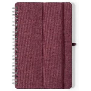 A burgundy notebook with a textured cover and spiral binding, featuring a secure elastic band.