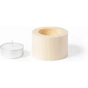 A wooden candle holder in a light natural finish beside a small tea light candle. The holder has a simple, cylindrical design.