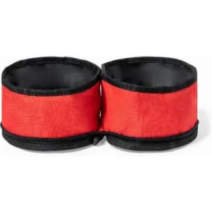 A set of red drink bottle holders linked together with a black trim, featuring an internal lining.