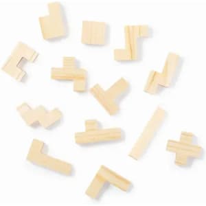 A collection of wooden puzzle pieces in various shapes, arranged haphazardly on a white background.