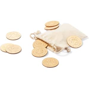 A set of wooden coins scattered next to a small canvas bag. The coins feature various engraved designs.