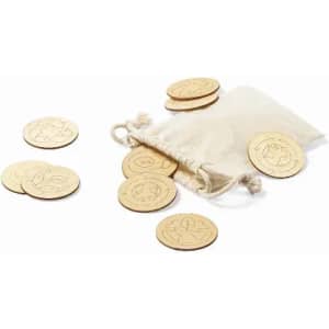 A muslin pouch contains wooden tokens with various engraved designs, scattered around on a white background.