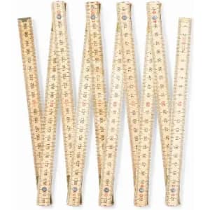 A set of six wooden folding rulers with metric and imperial measurements. They are light beige in colour.