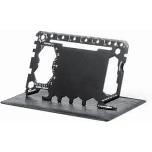 A black multi-tool card displayed upright on a black stand, featuring various measurement markings and tools.