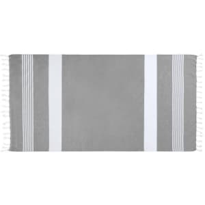 A grey towel featuring white stripes and tassels on the edges, with a smooth texture.