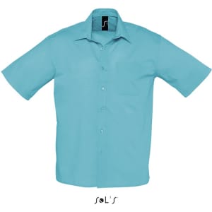 A short sleeve men's shirt in a light blue poplin fabric with a chest pocket and a logo at the collar.