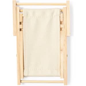 A miniature deck chair made of light wood with a cream canvas seat. The chair features a simple, foldable design.