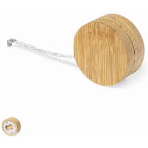 A tape measure with a bamboo casing, featuring a retractable white measuring tape.