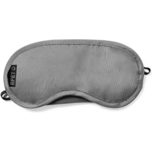 A sleep mask in grey fabric, featuring a logo on the side and a contoured shape for comfort.