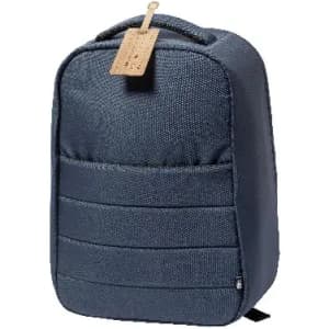 A backpack in dark blue fabric with a textured finish and a tag attached. It features a front pocket.