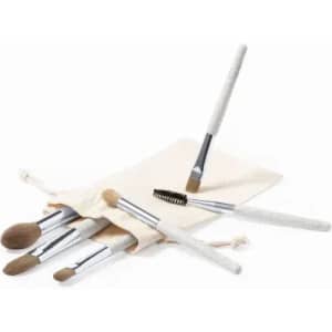 A makeup brush set displayed on a natural fabric pouch, featuring various brushes with white handles and silver ferrules.
