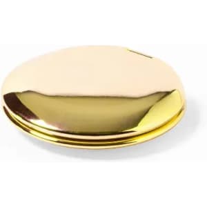 A golden compact with a reflective surface. It features a smooth, rounded design and has a logo on the top.