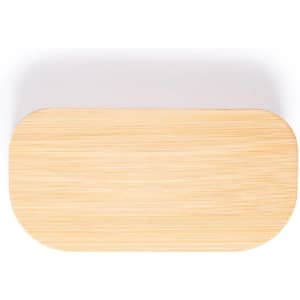 A bamboo-like rectangular tray with rounded edges. The surface has a light wooden finish and a plain design.
