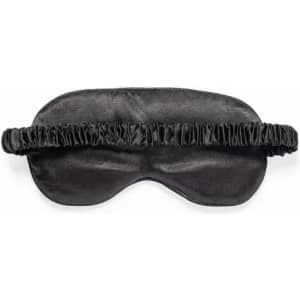 A sleep mask in black satin with a soft, gathered elastic band for comfort. Features a smooth texture and a classic design.